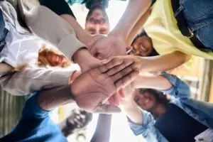Team putting hands together